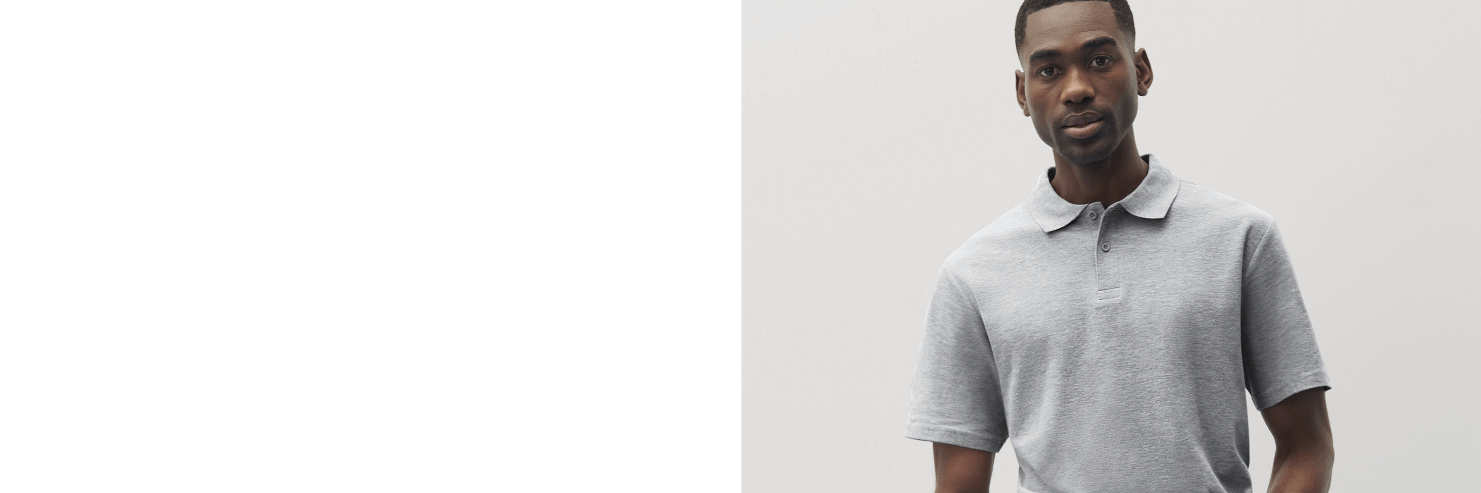 Man wearing a gray polo shirt against a plain background